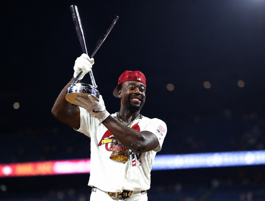 Cardinals Baseball Player holding a trophy