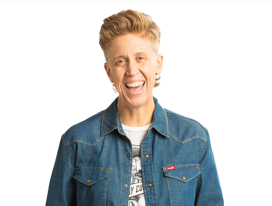Heather Holloway smiling at the camera with a blue denim jacket on.
