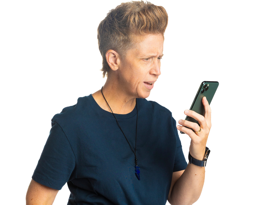 Heater Holloway looking at her phone with a confused look.